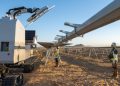 Robots install 100 MW of solar panels on 1-GW AES project
